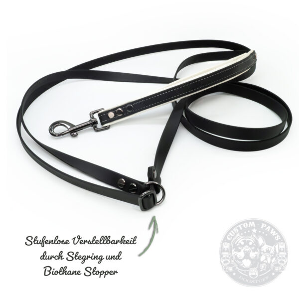 a black cross body leash made out of biothane