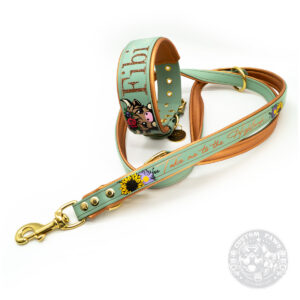 a dog leash and collar with a highland cow